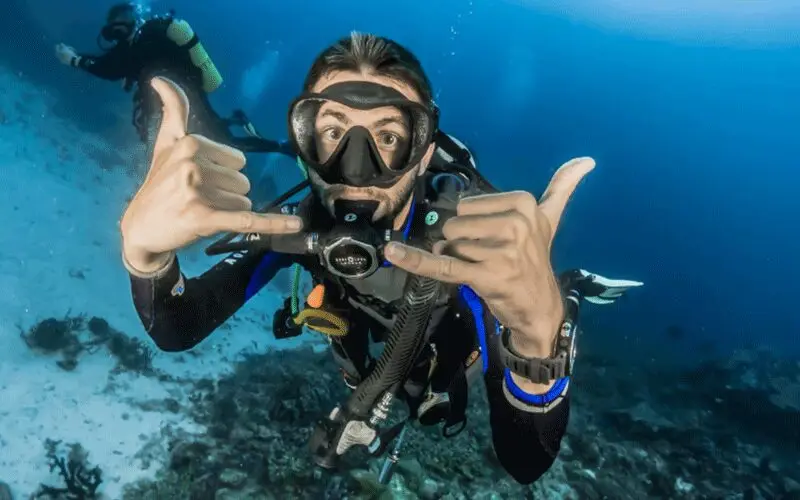Scuba diver exploring a coral reef in Boracay