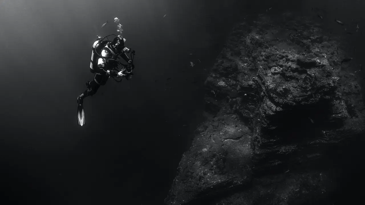 A certified diver exploring deeper water on a Boracay reef