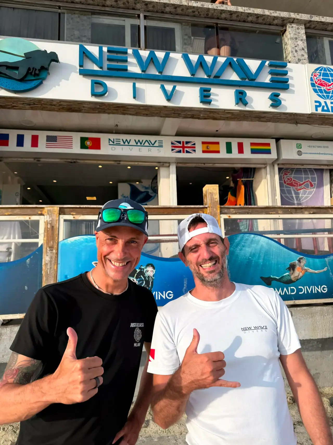 Freediving Planet Instructor Trainer JP with New Wave Divers' freediving coach outside the shop in Boracay