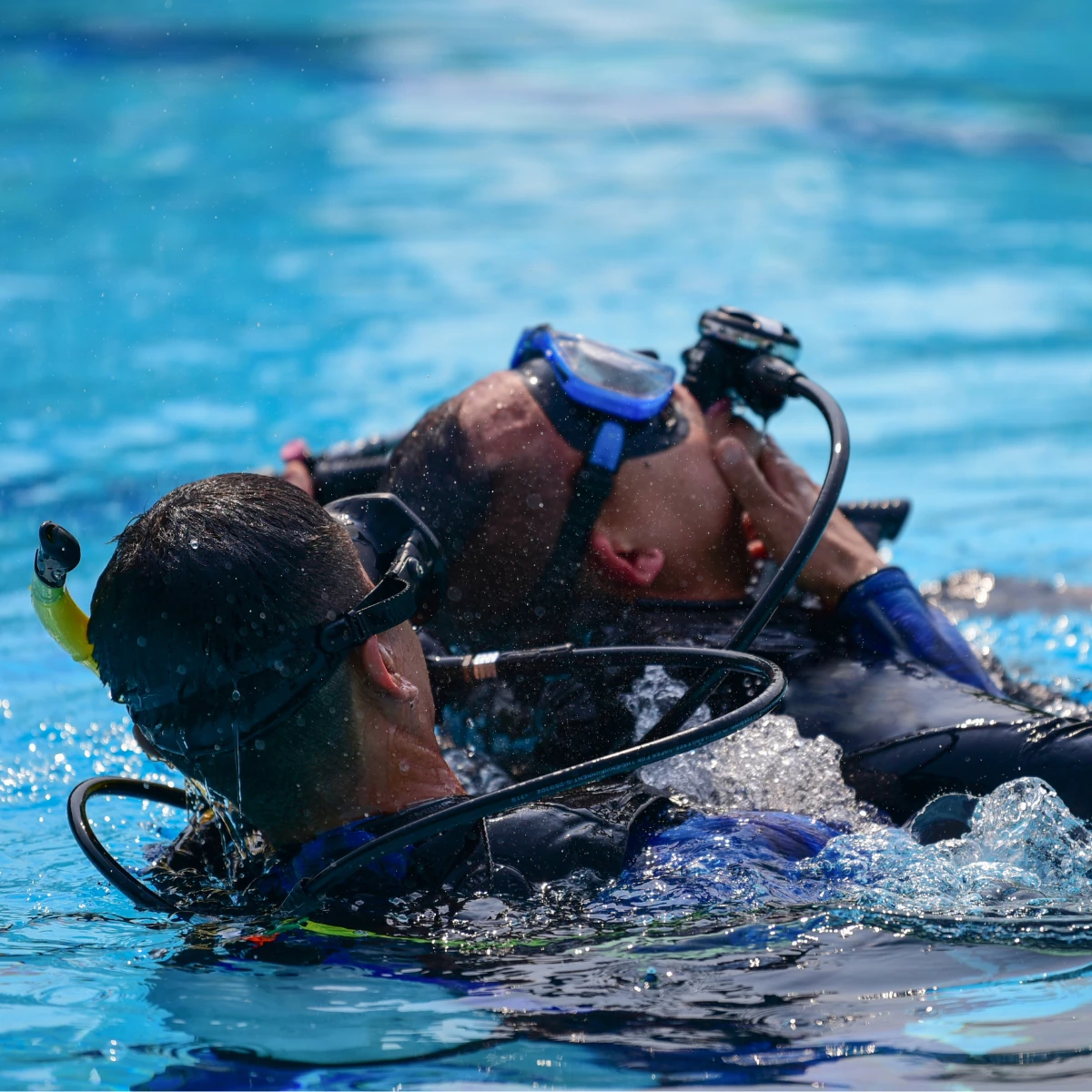 PADI Rescue Diver practicing a rescue tow in open water