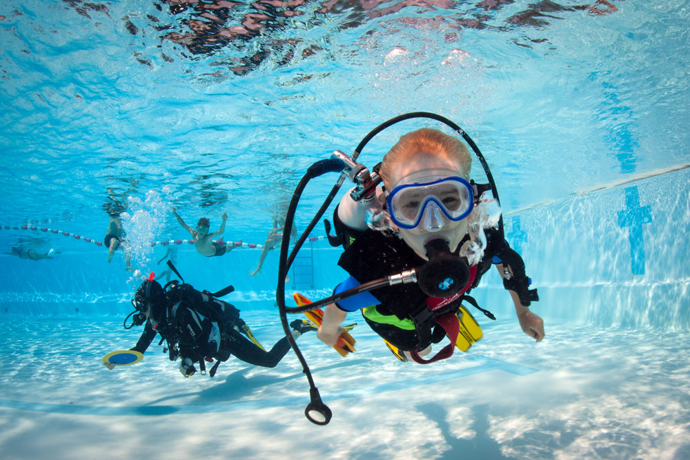 A child on scuba in the pool